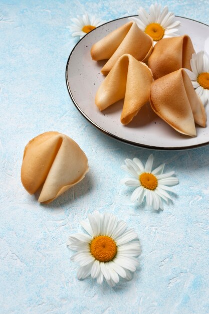 High angle fortune cookies with flowers