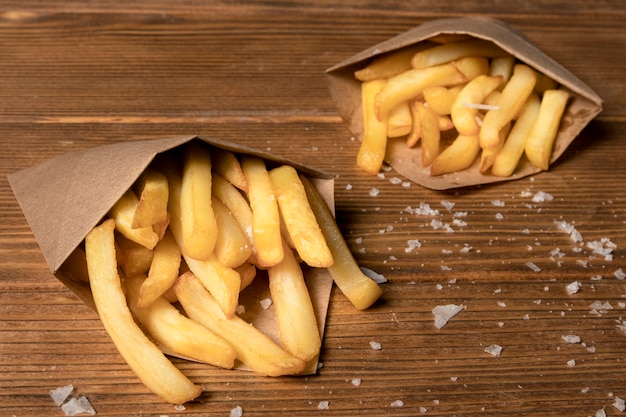 High angle of french fries with salt