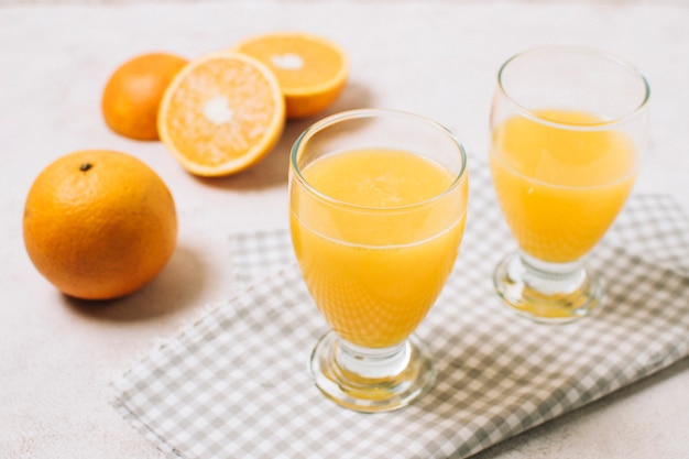 Free photo high angle fresh orange juice in glass