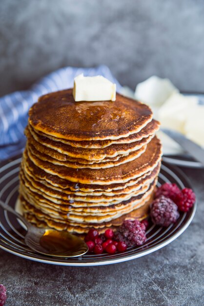 High angle fresh pancakes with butter