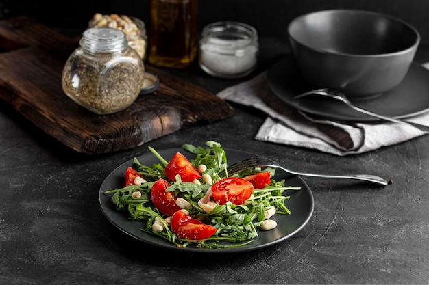 High angle fresh salad with dark tableware