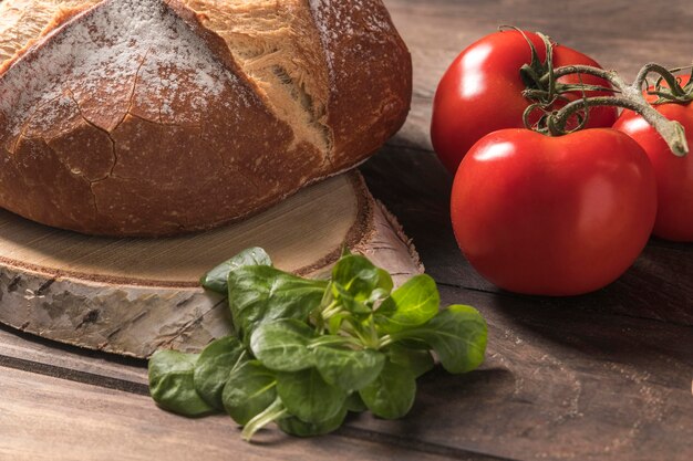 High angle fresh tomatoes and bread