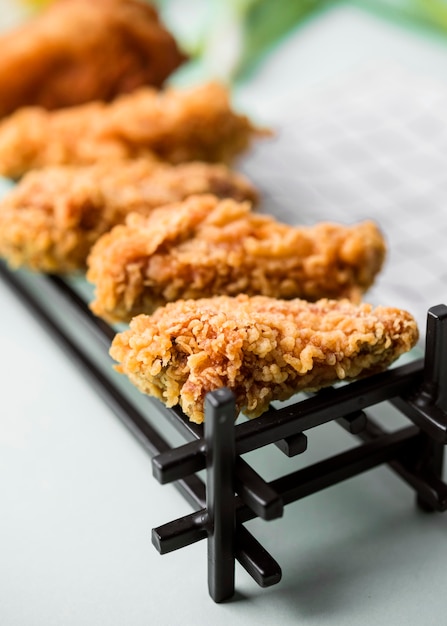 High angle fried chicken pieces on tray