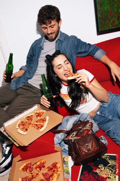 High angle friends eating pizza