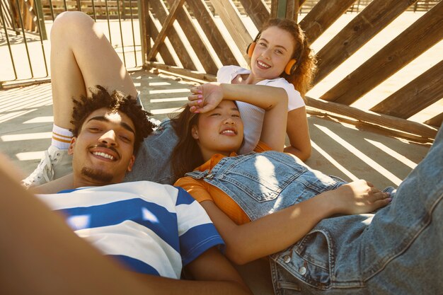 High angle friends laying outdoors