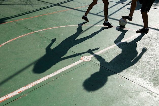 High angle friends playing soccer