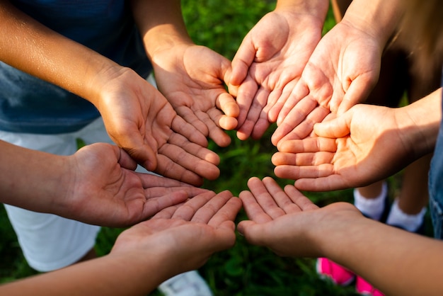 High angle friends showing hands for camera