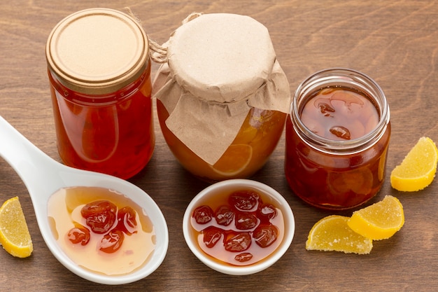 High angle fruit jam in jars and bowl