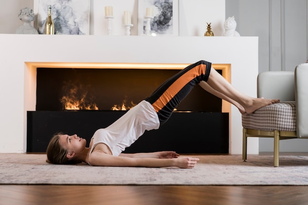 High angle girl doing sport at home