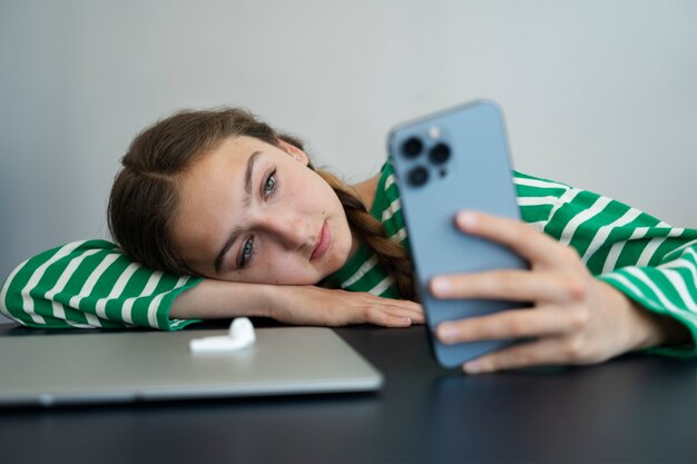 High angle girl holding smartphone