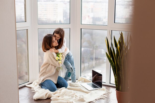 High angle girl hugging mother