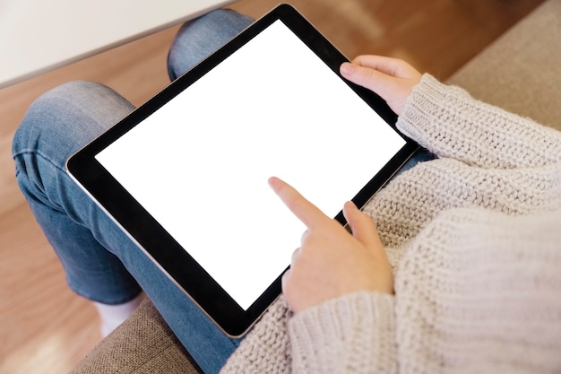 High angle of girl on tablet with copy space