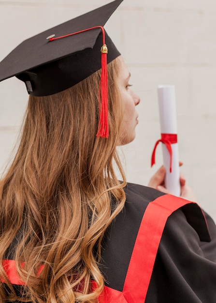 High angle girl with diploma