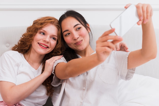 High angle girlfriends taking selfie