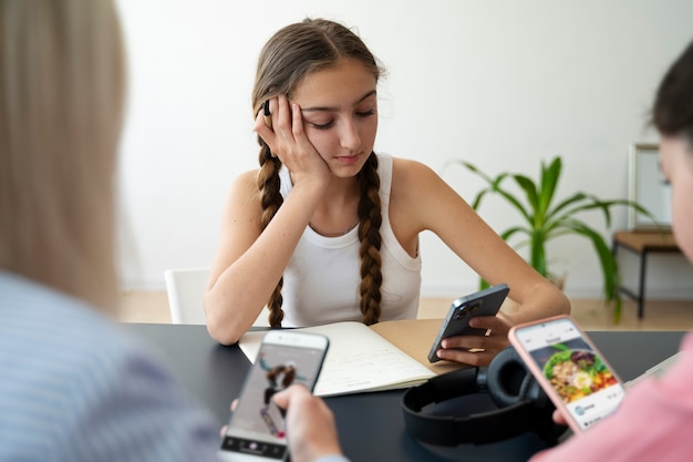 High angle girls holding devices