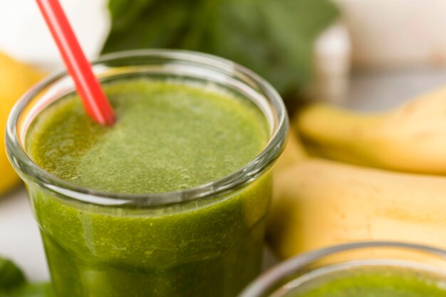 High angle glass of green smoothie