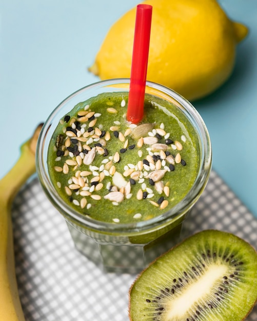 Free photo high angle glass of kiwi smoothie