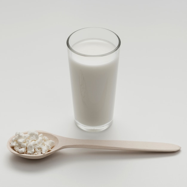 Free photo high angle glass of milk on white background