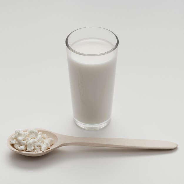 High angle glass of milk on white background