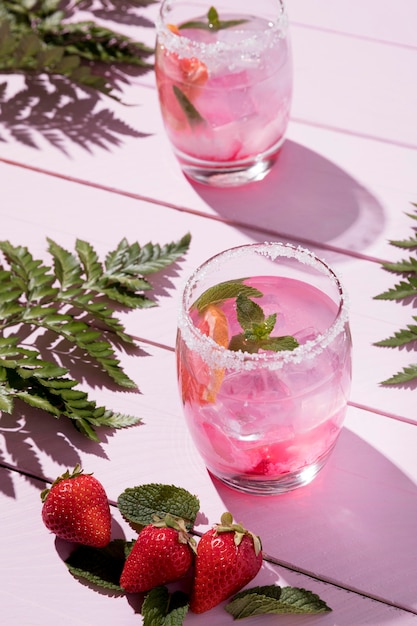 High angle glass with cold strawberry drink