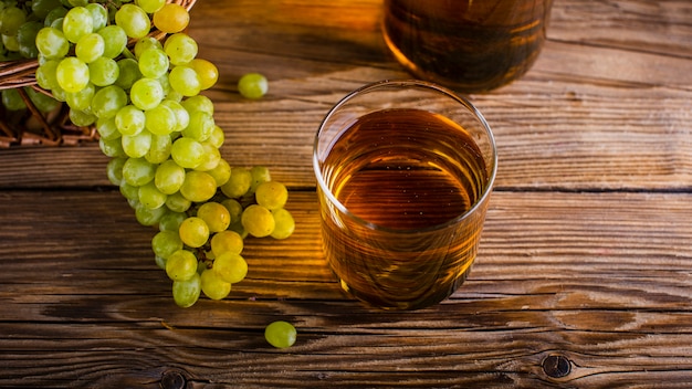 High angle glass with natural grapes bunches