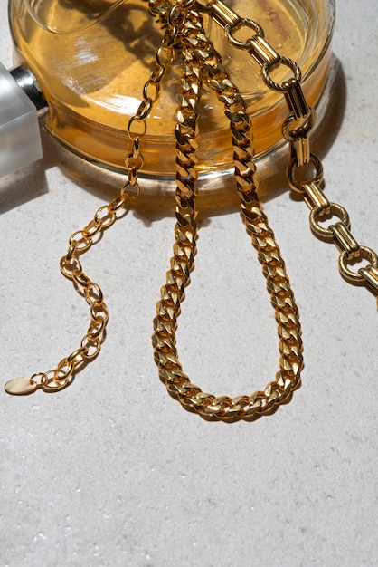 Free photo high angle gold chains arrangement