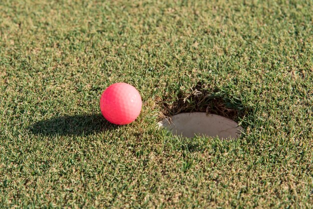 High angle golf ball on field