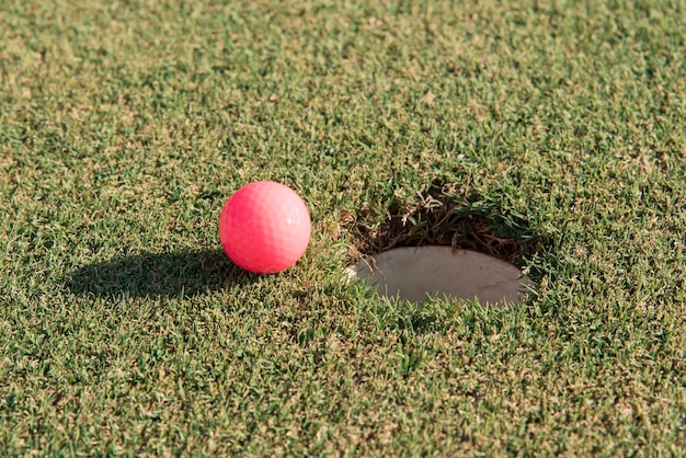 High angle golf ball on field