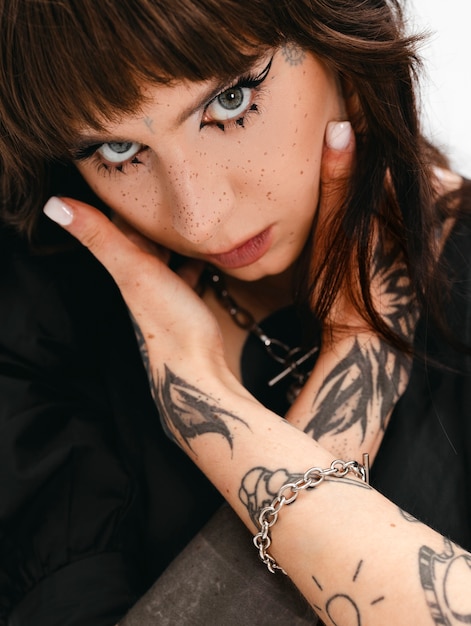 High angle goth teenager posing in studio