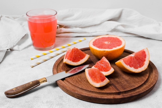 High angle of grapefruit slices with juice