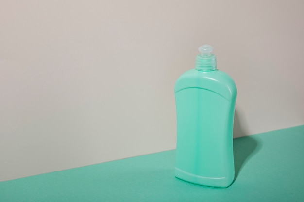 High angle green plastic bottle with copy space