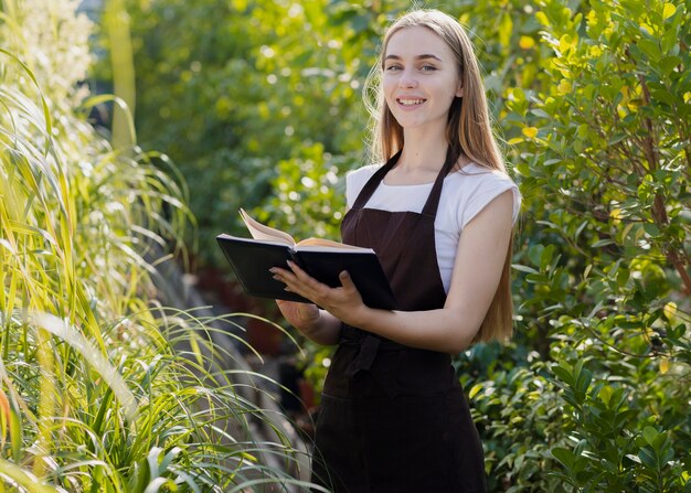 High angle greenhouse employee with agenda