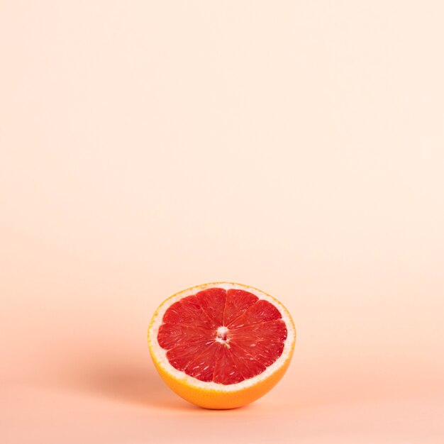 High angle half red orange with copy-space