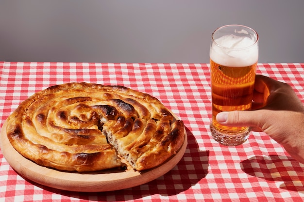 High angle hand holding beer glass