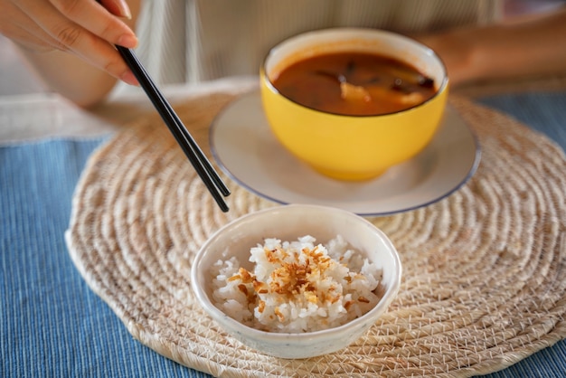 High angle hand holding chopsticks