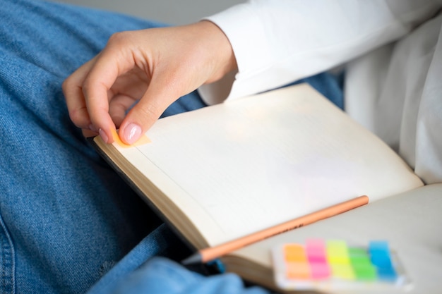 high angle hand holding notebook