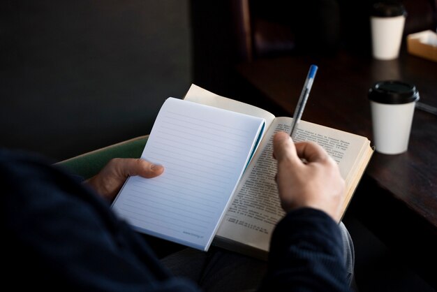 High angle hand holding notebook