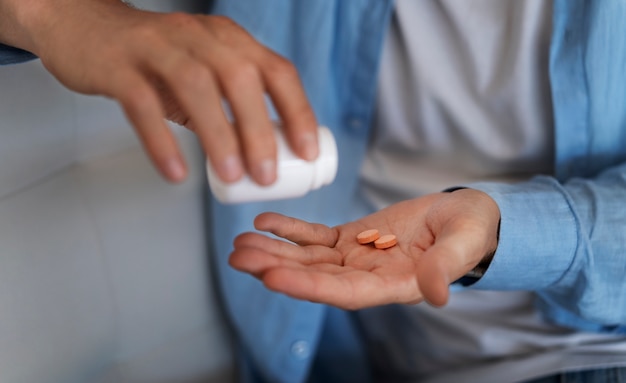 High angle hand holding pills