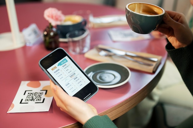 High angle hand holding smartphone with menu