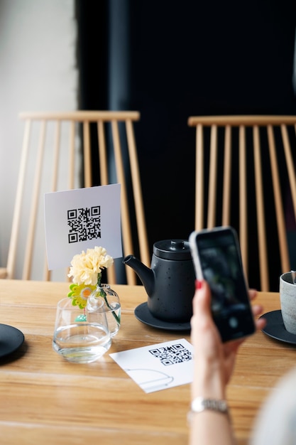 High angle hand scanning qr code with phone