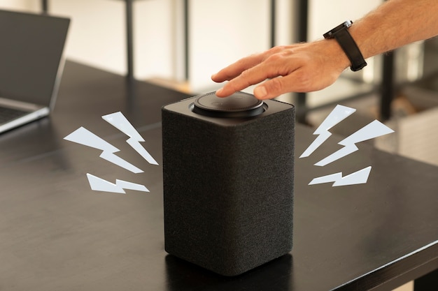 High angle hand touching speakers