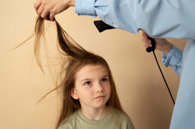 High angle hand using hair dryer