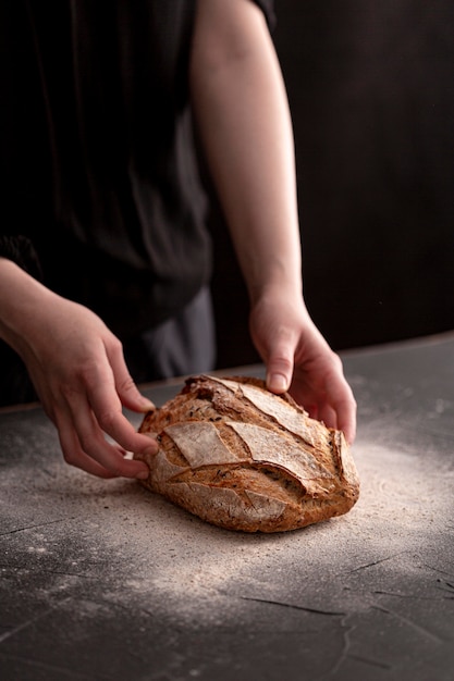 High angle hands holding bread