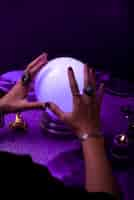 Free photo high angle hands holding crystal ball