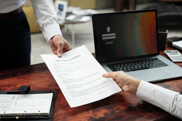 High angle hands holding document