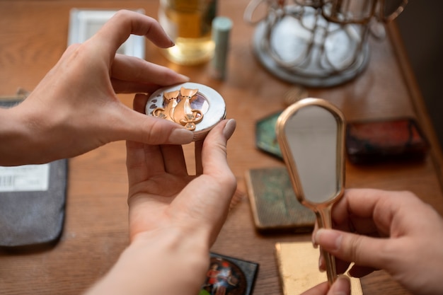 High angle hands holding mirror