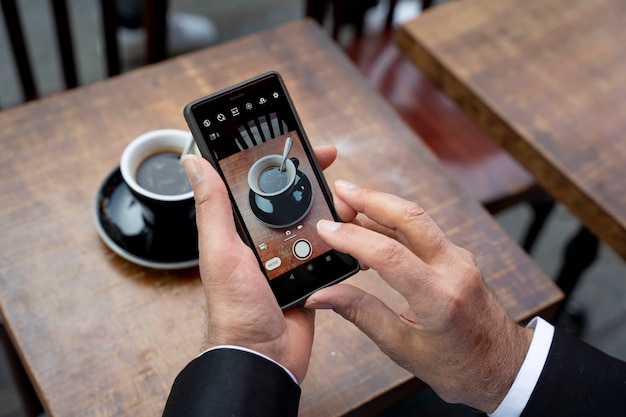 High angle hands holding smartphone