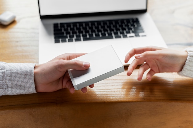 High angle hands holding ssd device