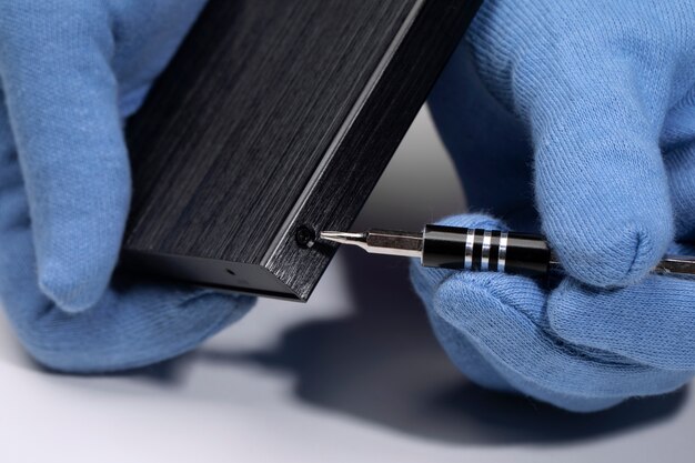 high angle hands opening hard drive