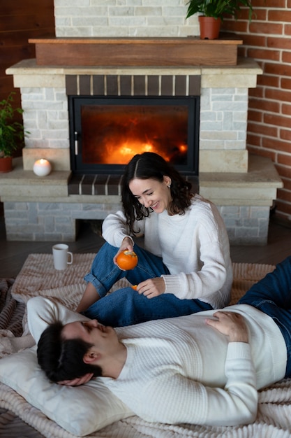 Free photo high angle happy couple on floor